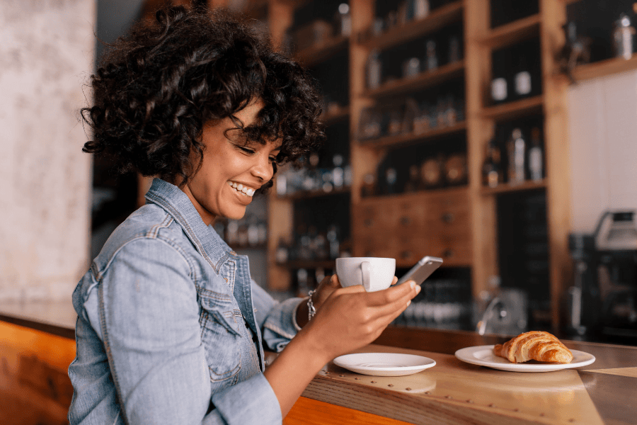 Woman on phone at a cafe